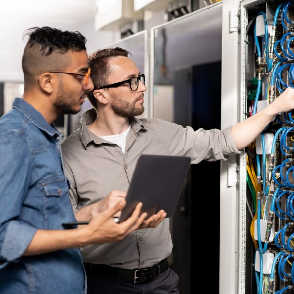 Computer support specialists analyzing network problem